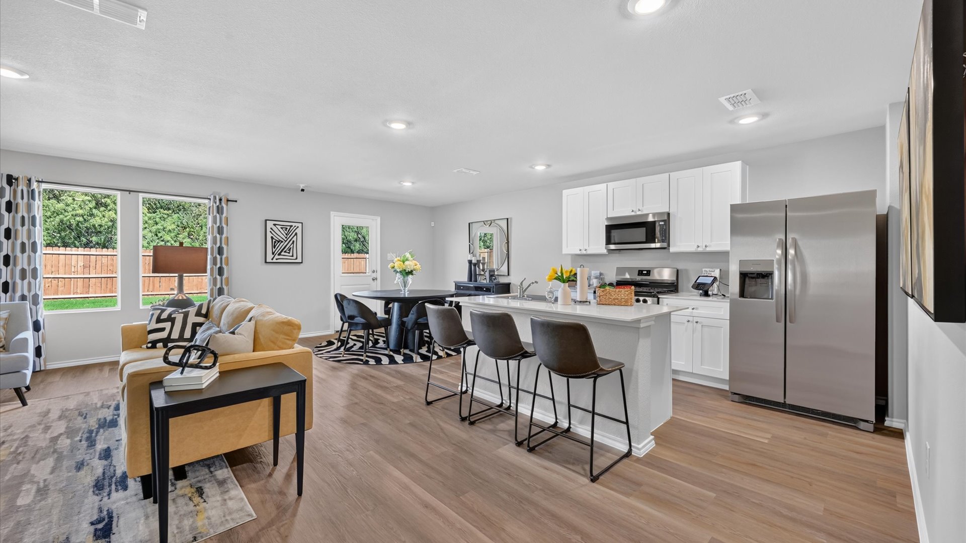 Open kitchen, living, and dining