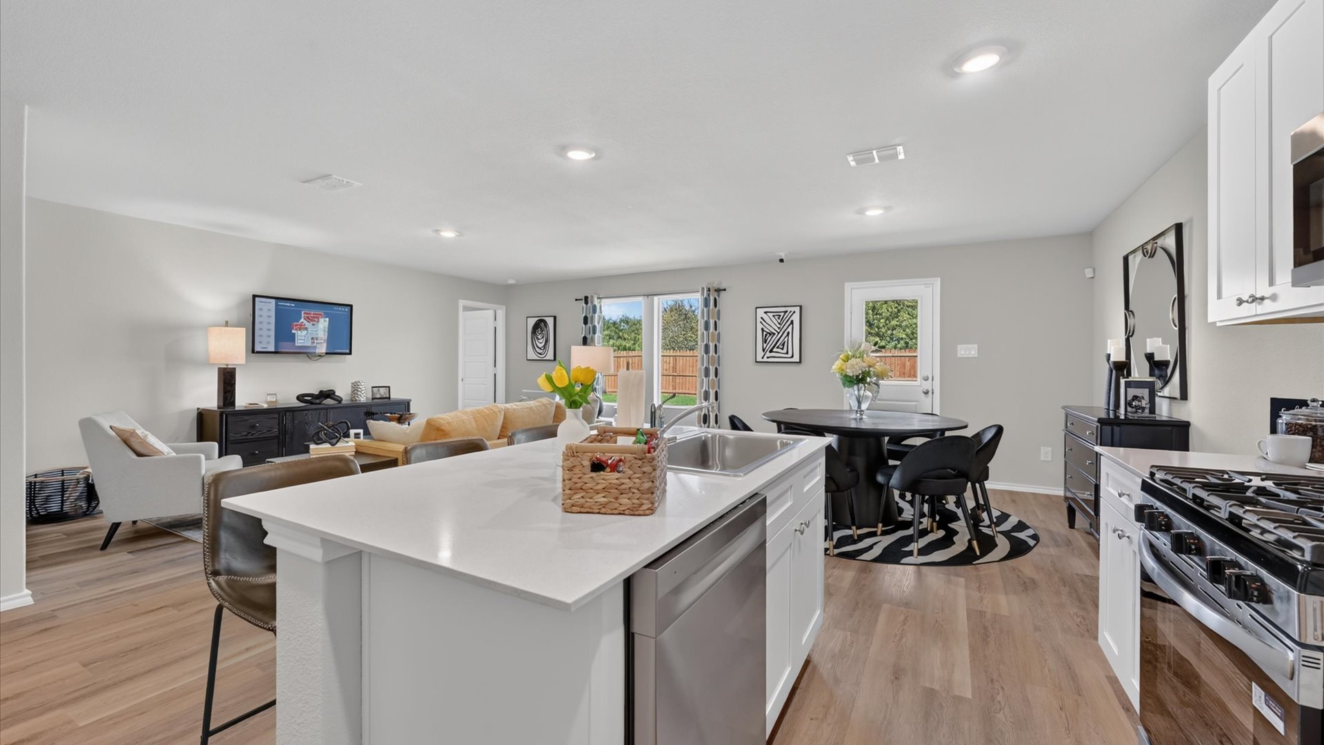 Kitchen overlooking living and dining area