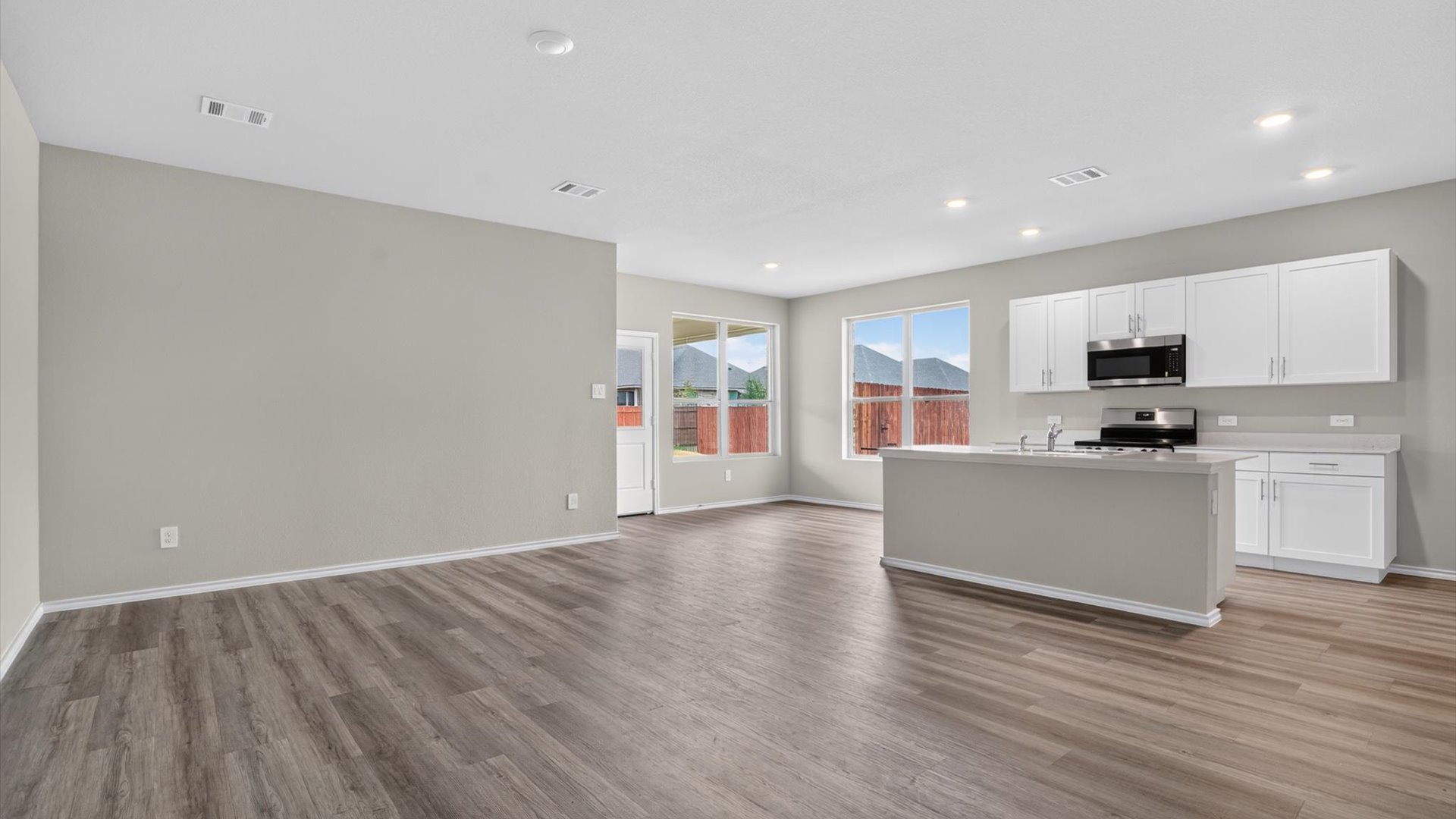 Open kitchen, living, and dining