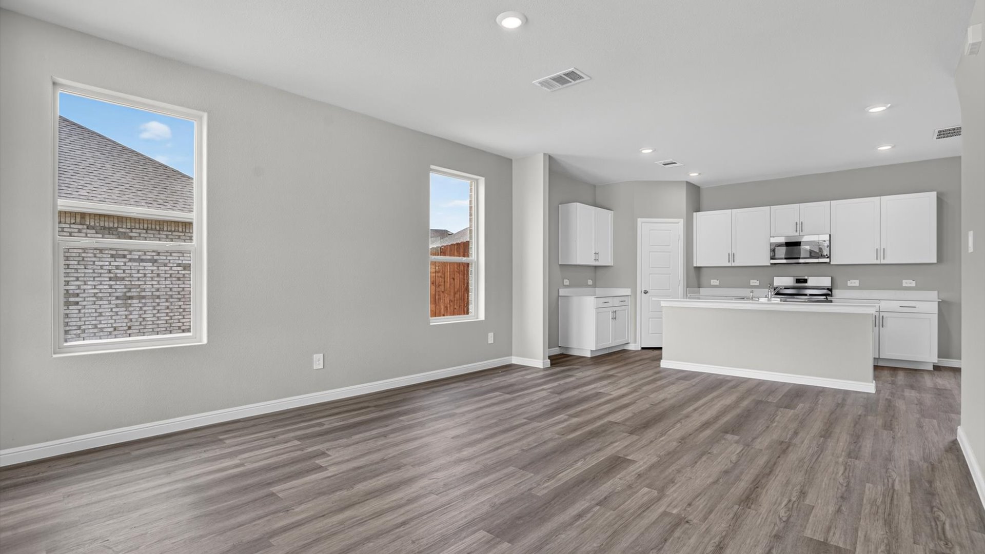 Open kitchen, dining, and living