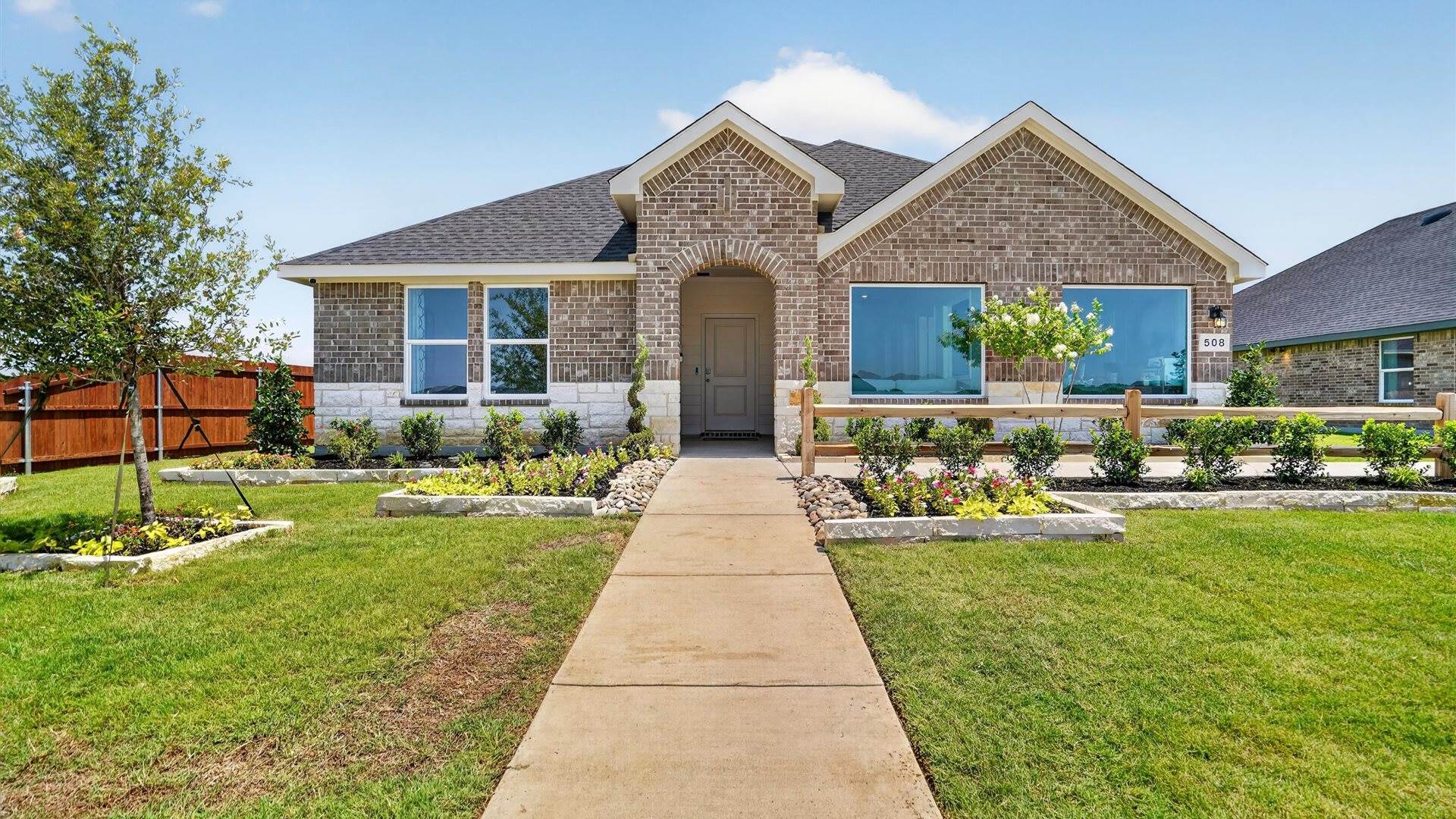 Kingston single-story home with brick and stone exterior