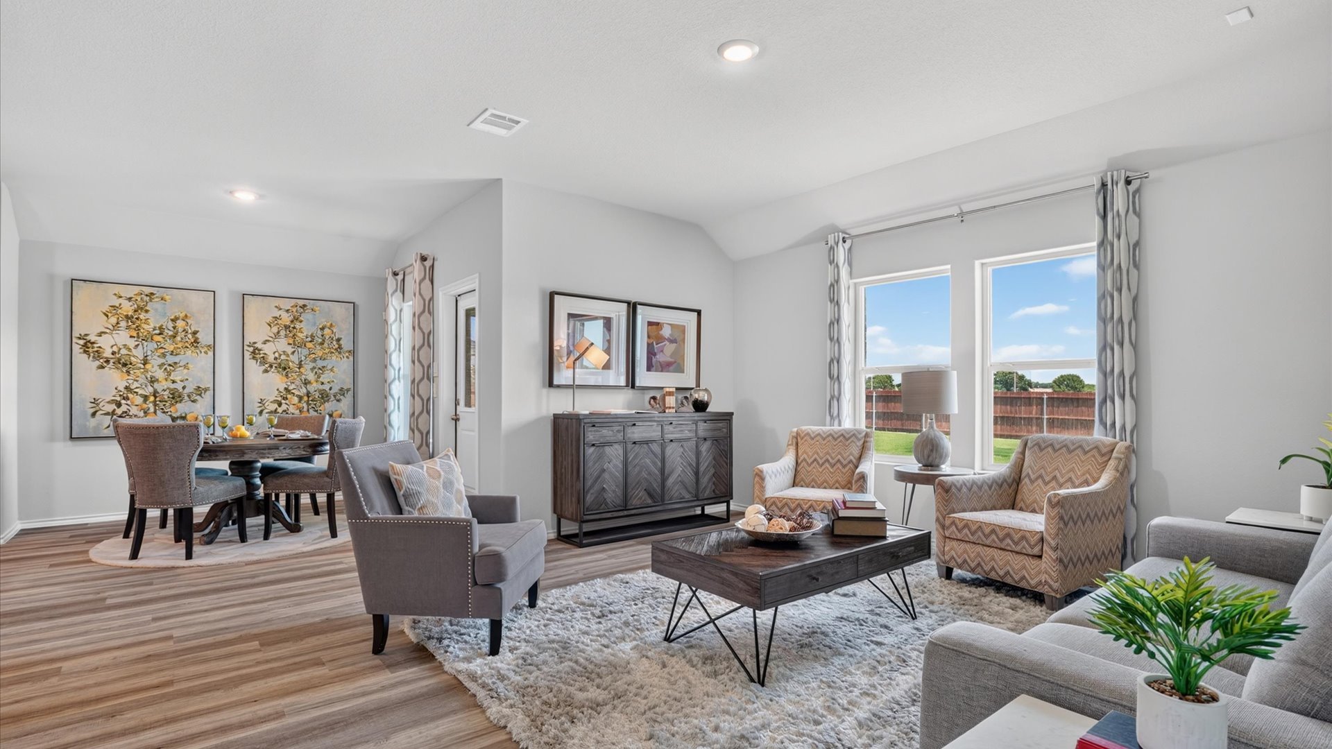 Open living/family room, dining area, and kitchen
