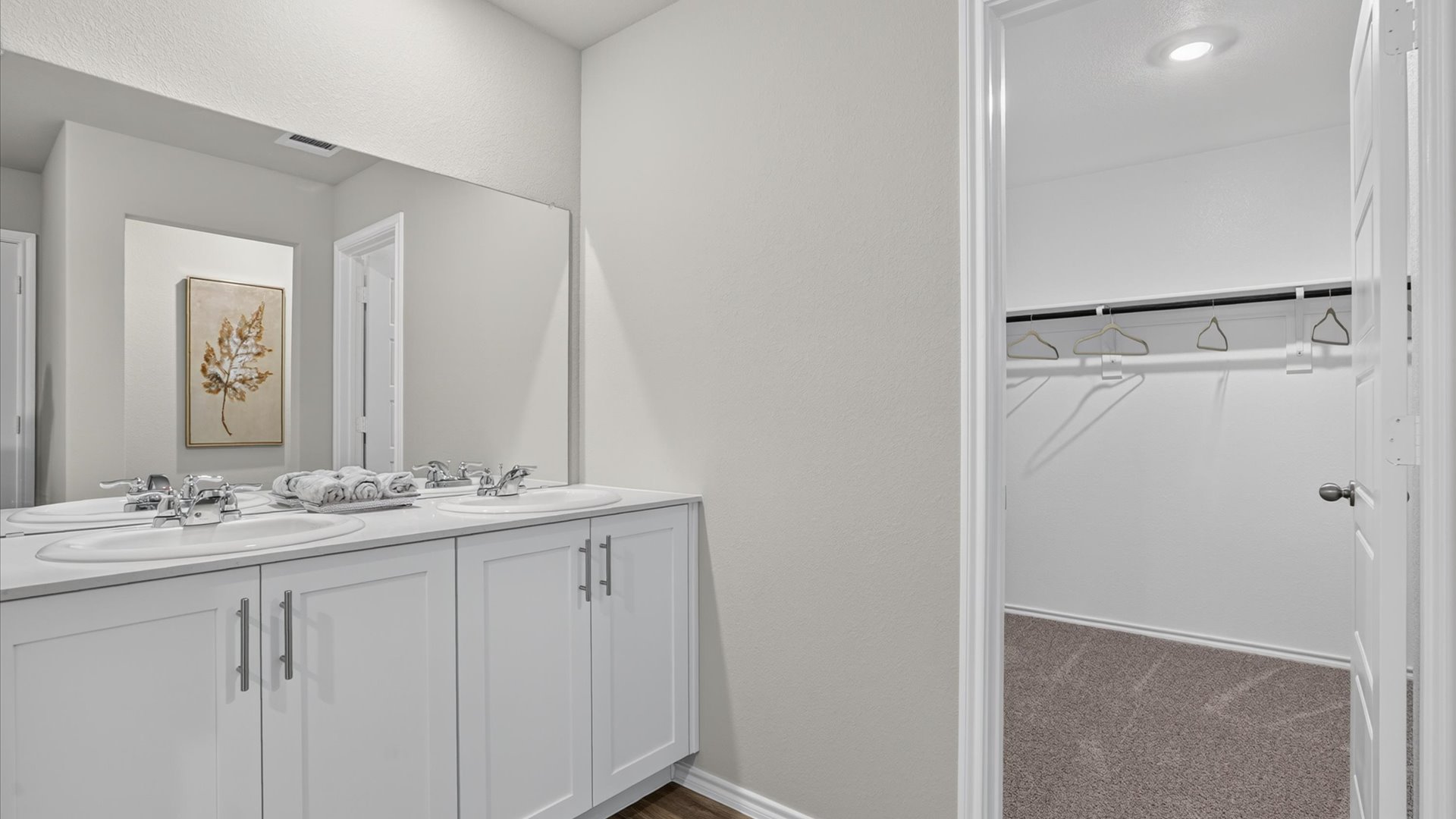 Private bath 1 with walk-in closet and luxurious vanity