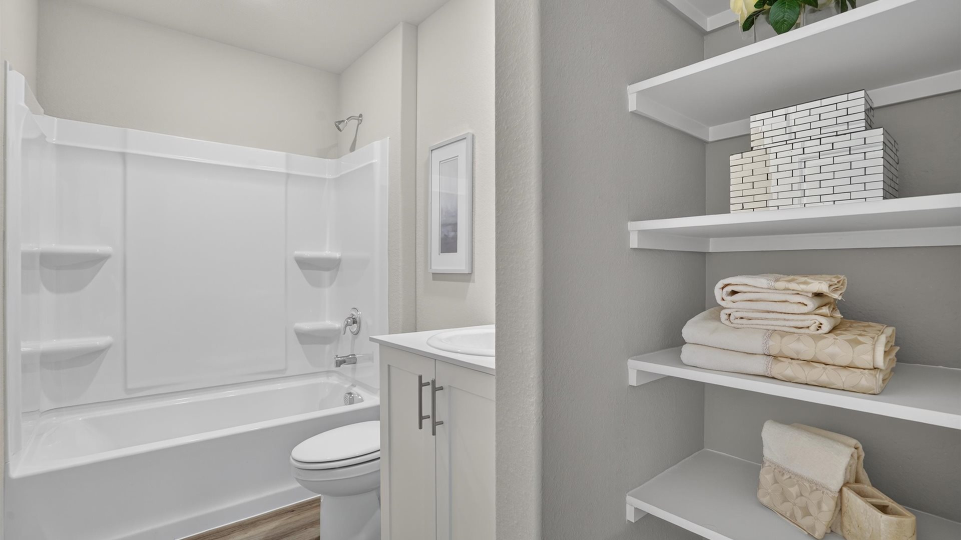 Bathroom 2 with combination bathtub and shower, vanity, and built-in storage