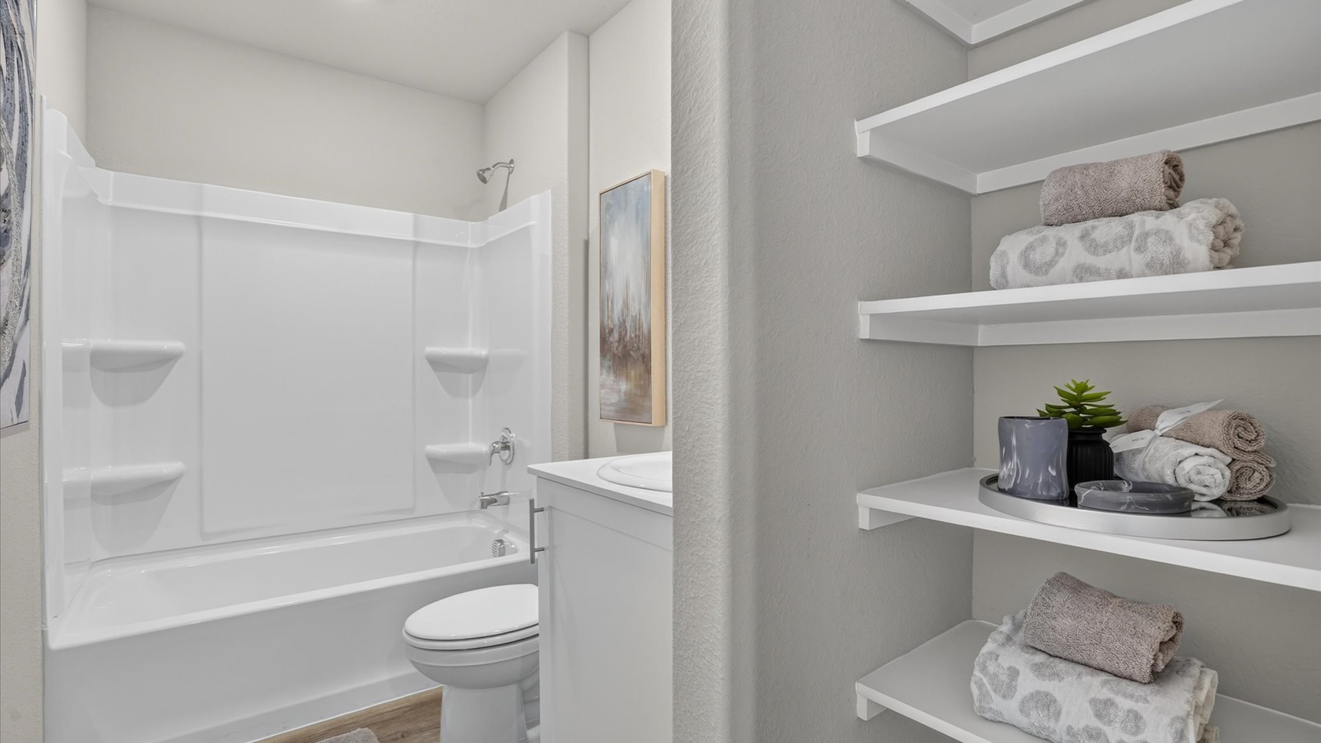 Bathroom 2 with combination bathtub/shower and built-in linen storage
