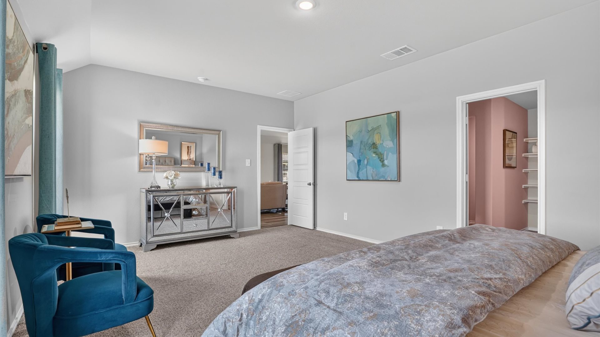 Spacious primary bedroom with attached bathroom