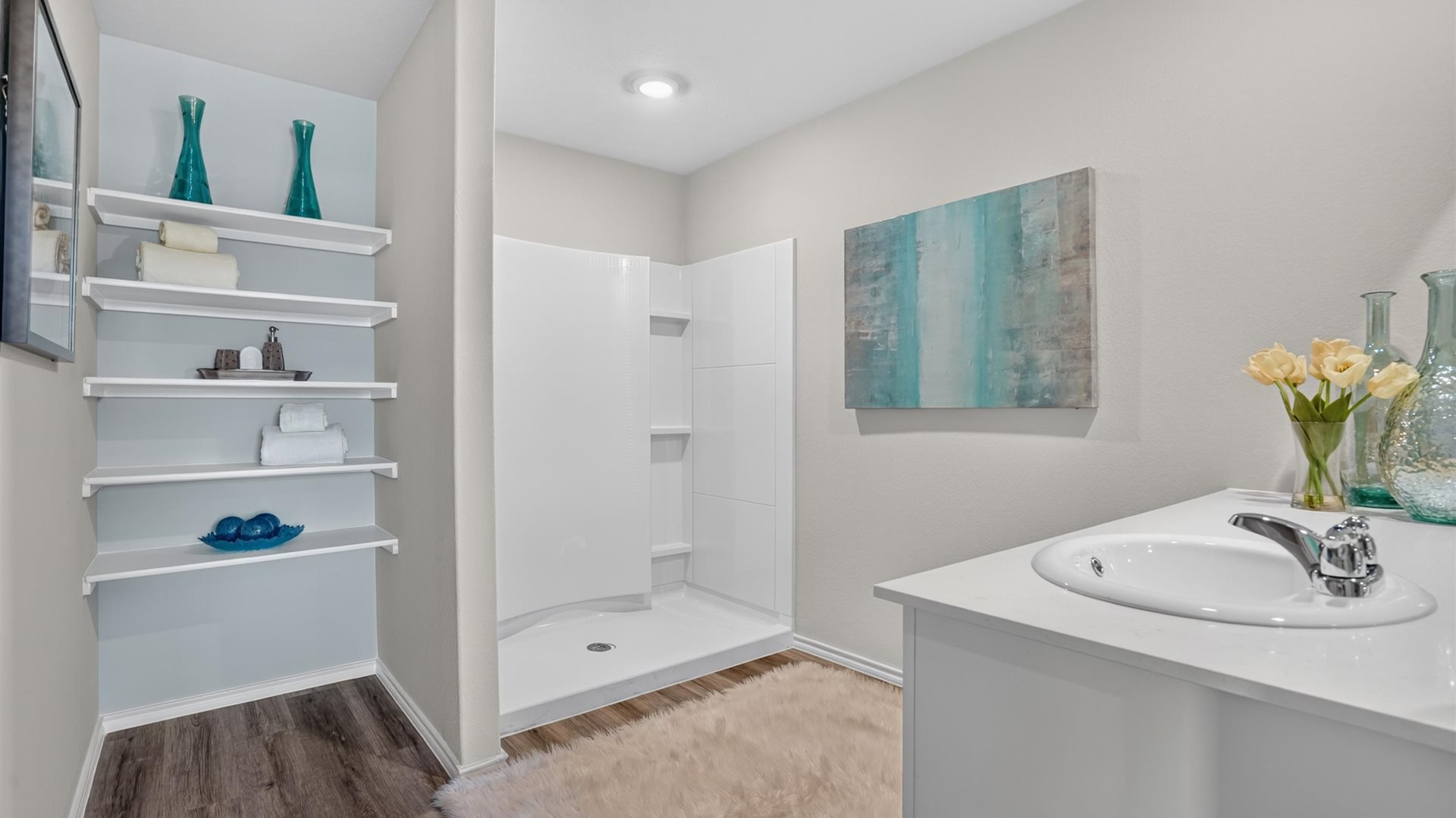 Bathroom 1 with vanity, shower, built in storage, and water closet