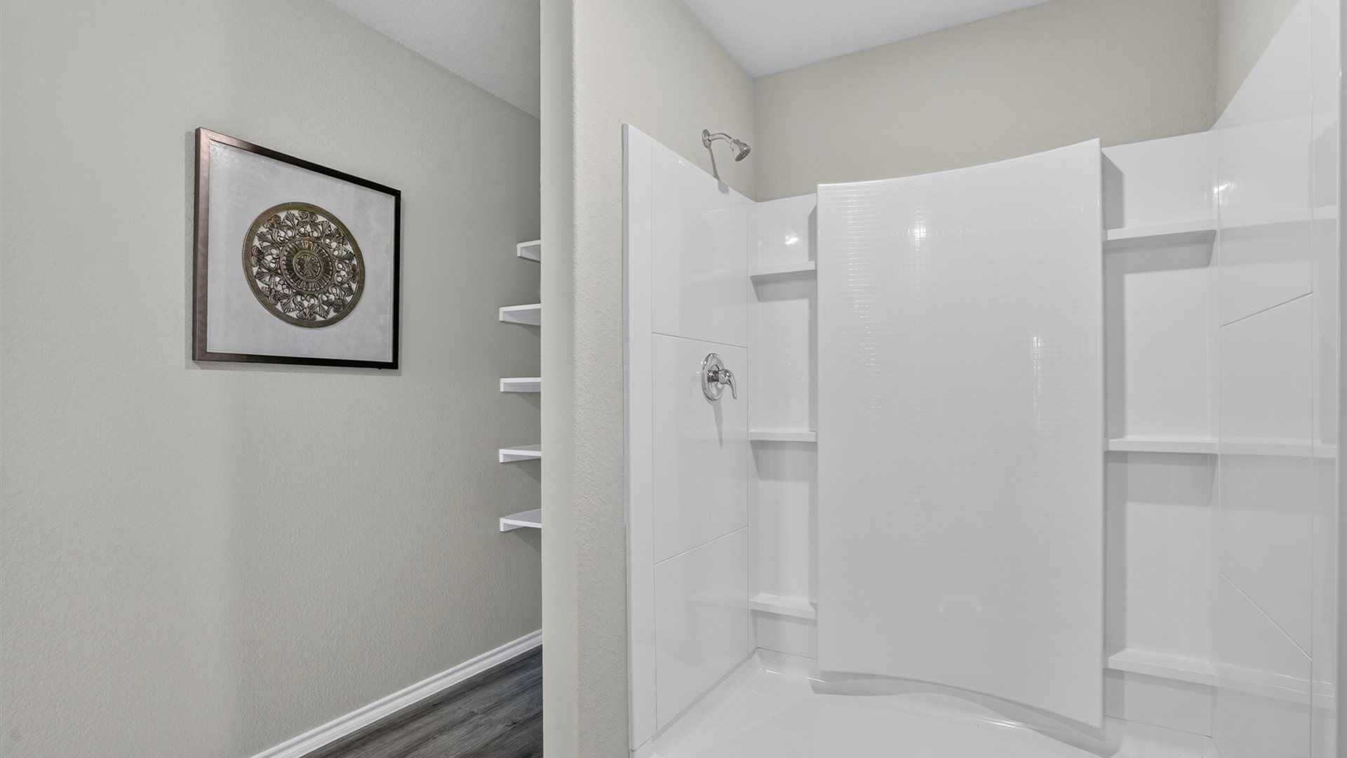 Primary bathroom with luxurious shower and built in storage