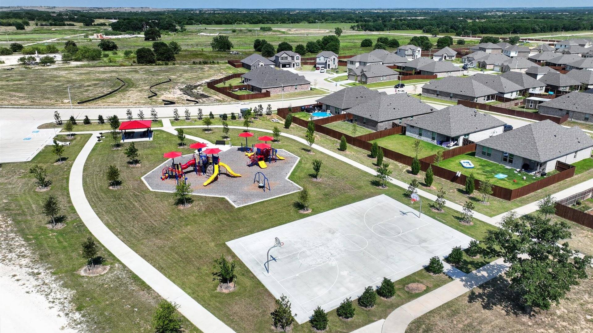 Community amenities in Saratoga offering basketball court, playground, and walking trail
