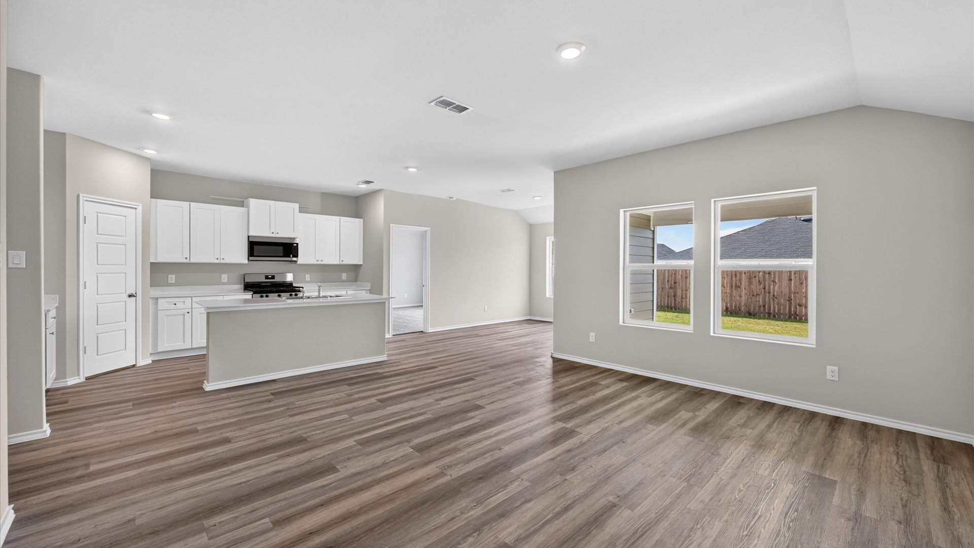 Open concept kitchen, living, and dining