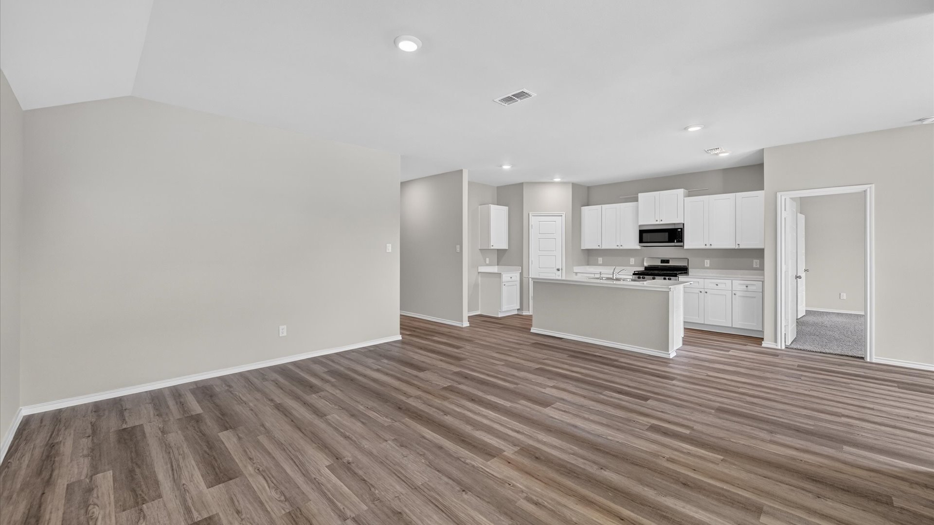 Open kitchen, dining, and living