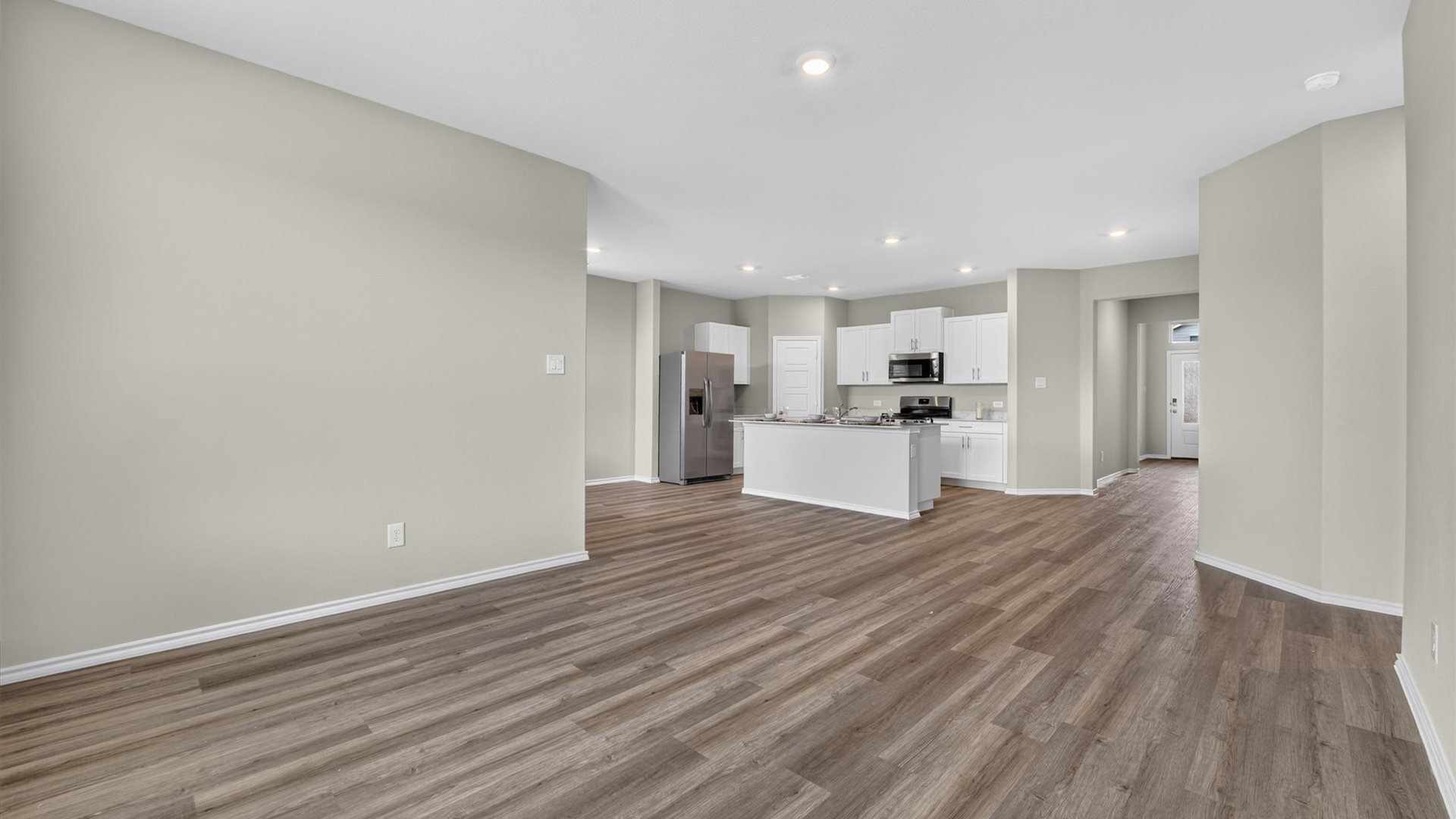 Open concept kitchen, dining, and living area