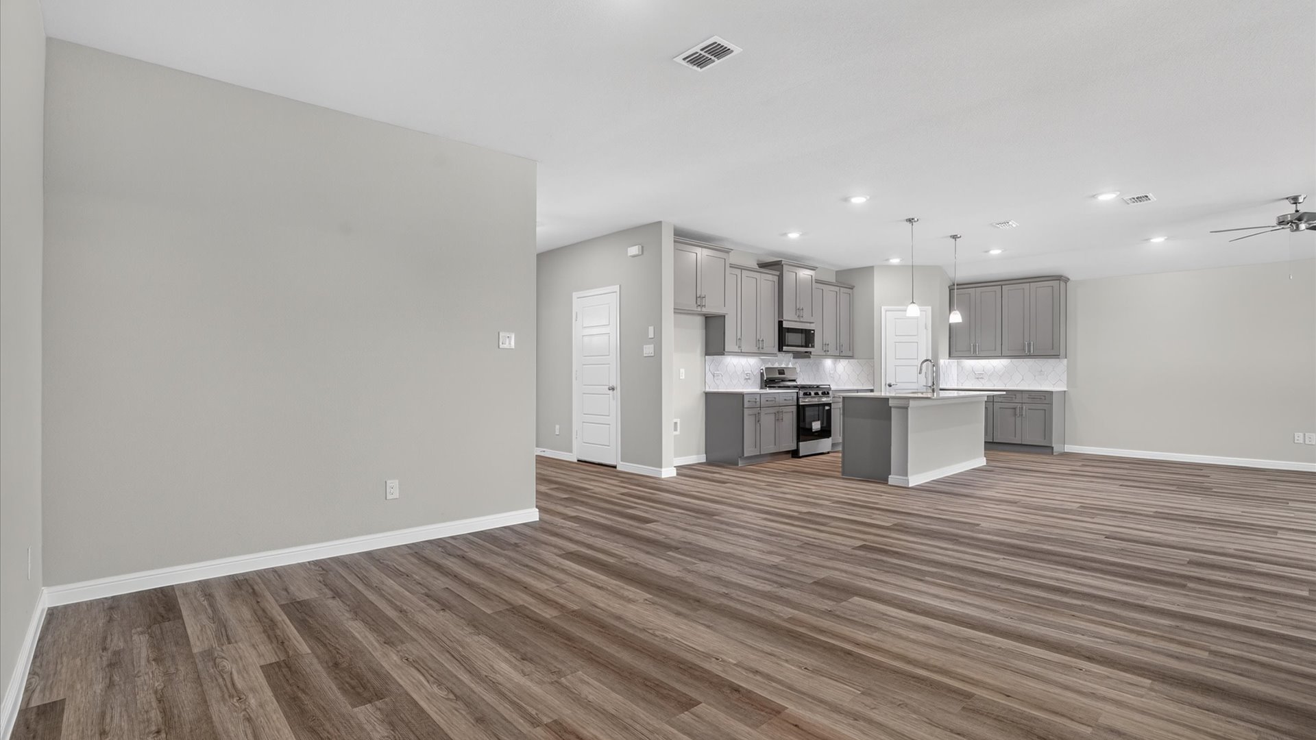 Open concept kitchen, living, and dining