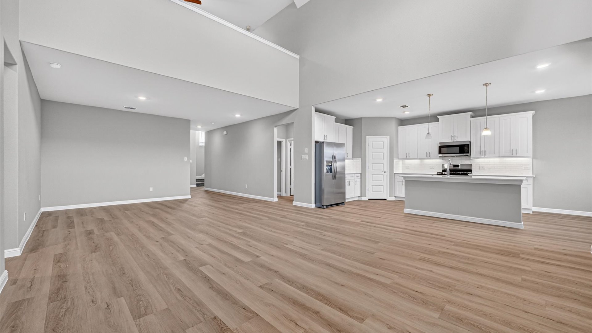 Open living and family room with elevated ceilings