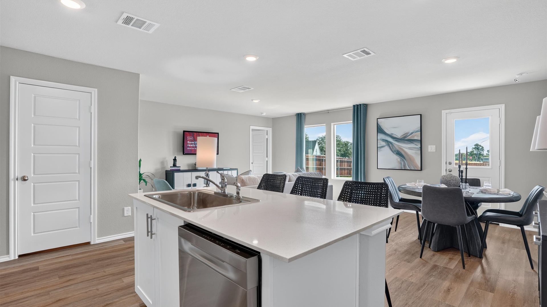 Kitchen overlooking dining and living areas