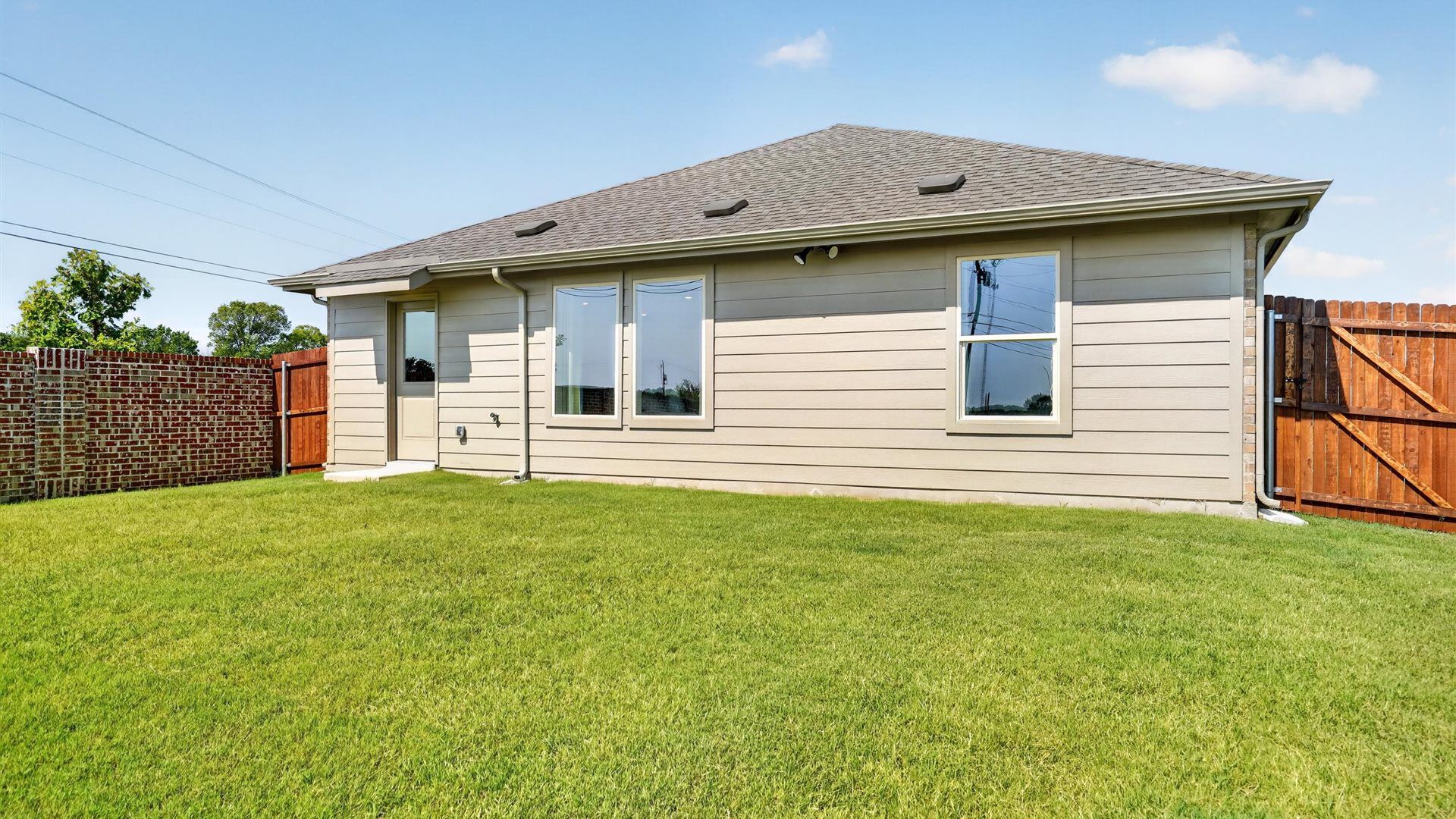 Spacious backyard with sod