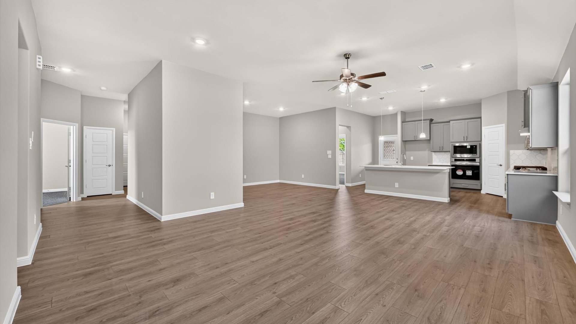 Open kitchen, dining, and living