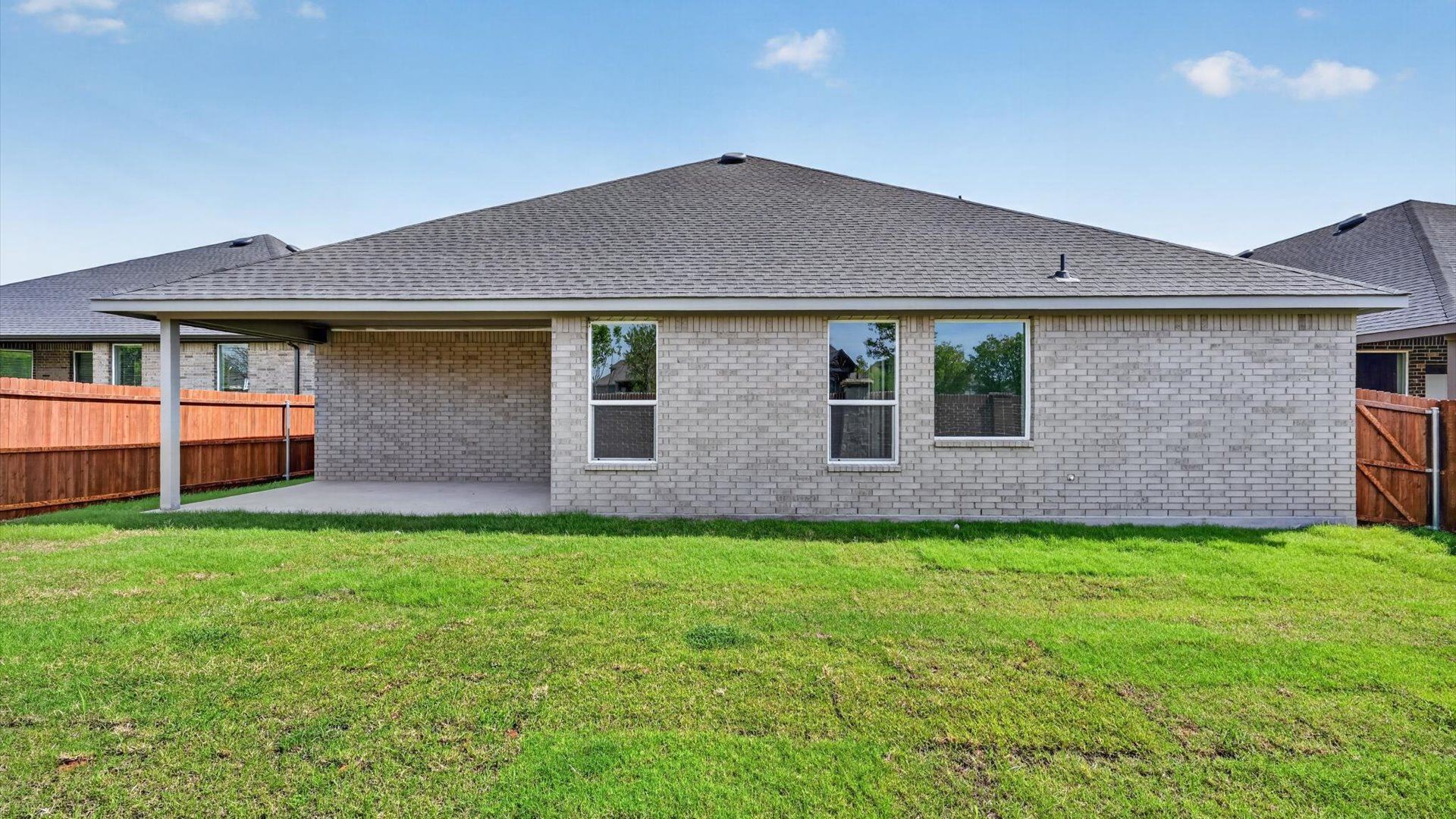 Spacious back patio and yard