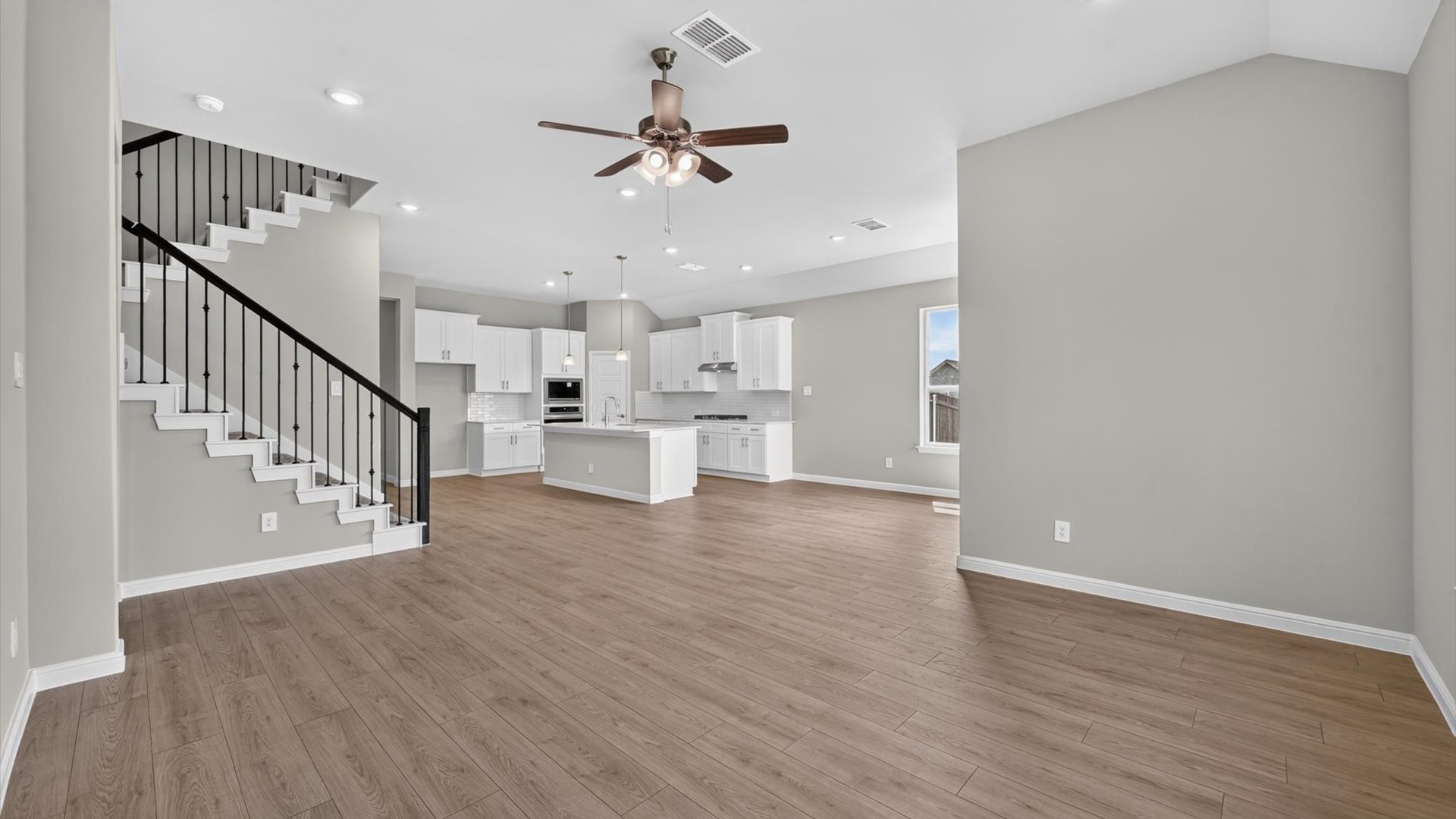Open kitchen, dining, and living area