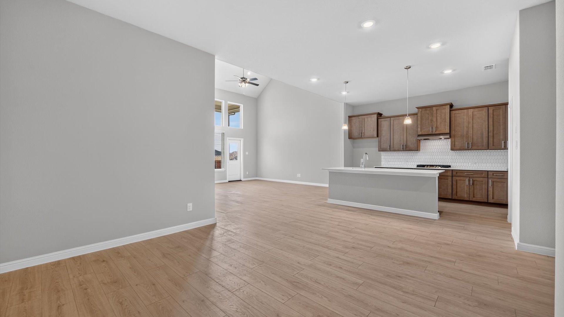 Open kitchen, dining, and living