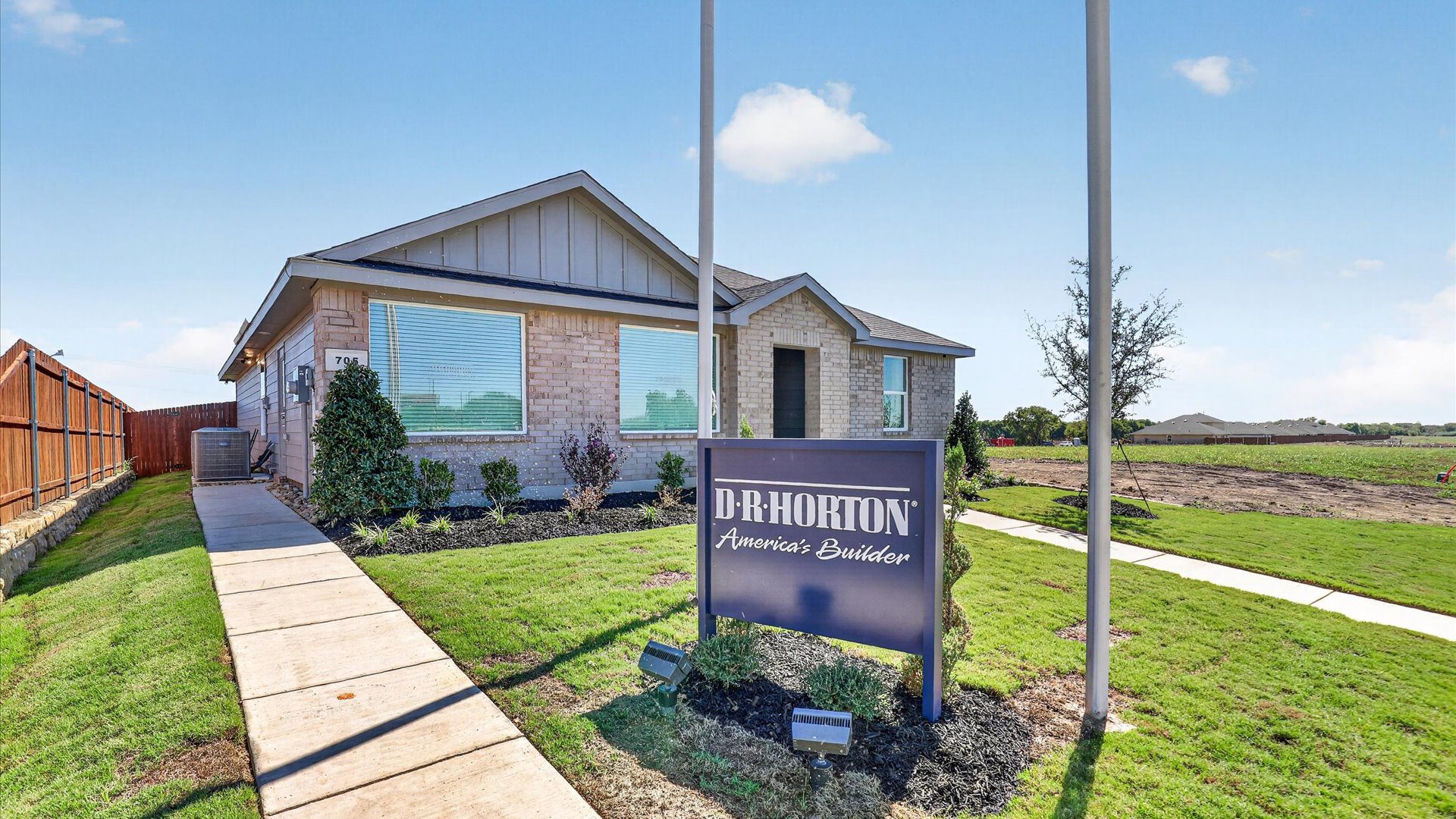 Somerset community entrance with Austin model home