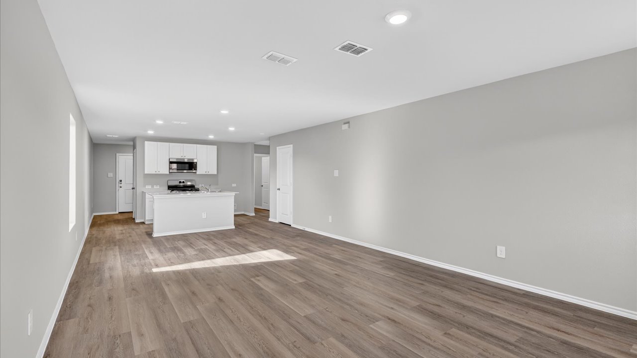 Open concept kitchen, dining, and living area