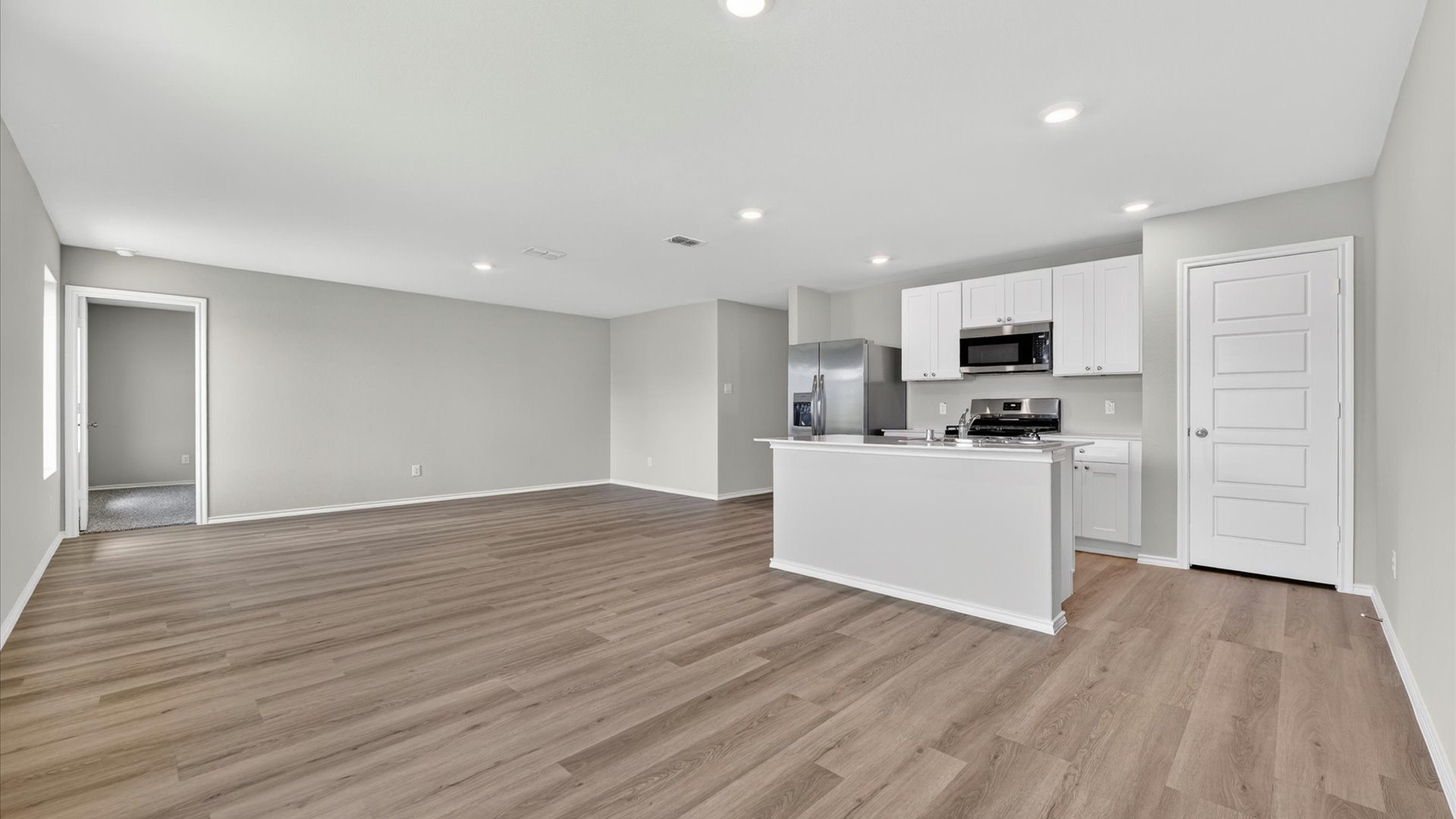 Open concept kitchen, dining, and living