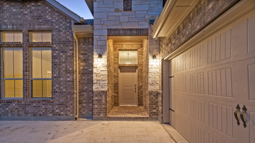 Modern brick single-story home front entrance