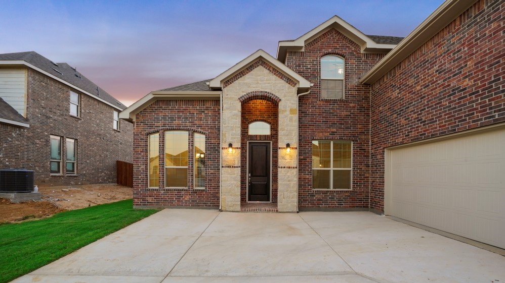 Front entry of classic brick family home