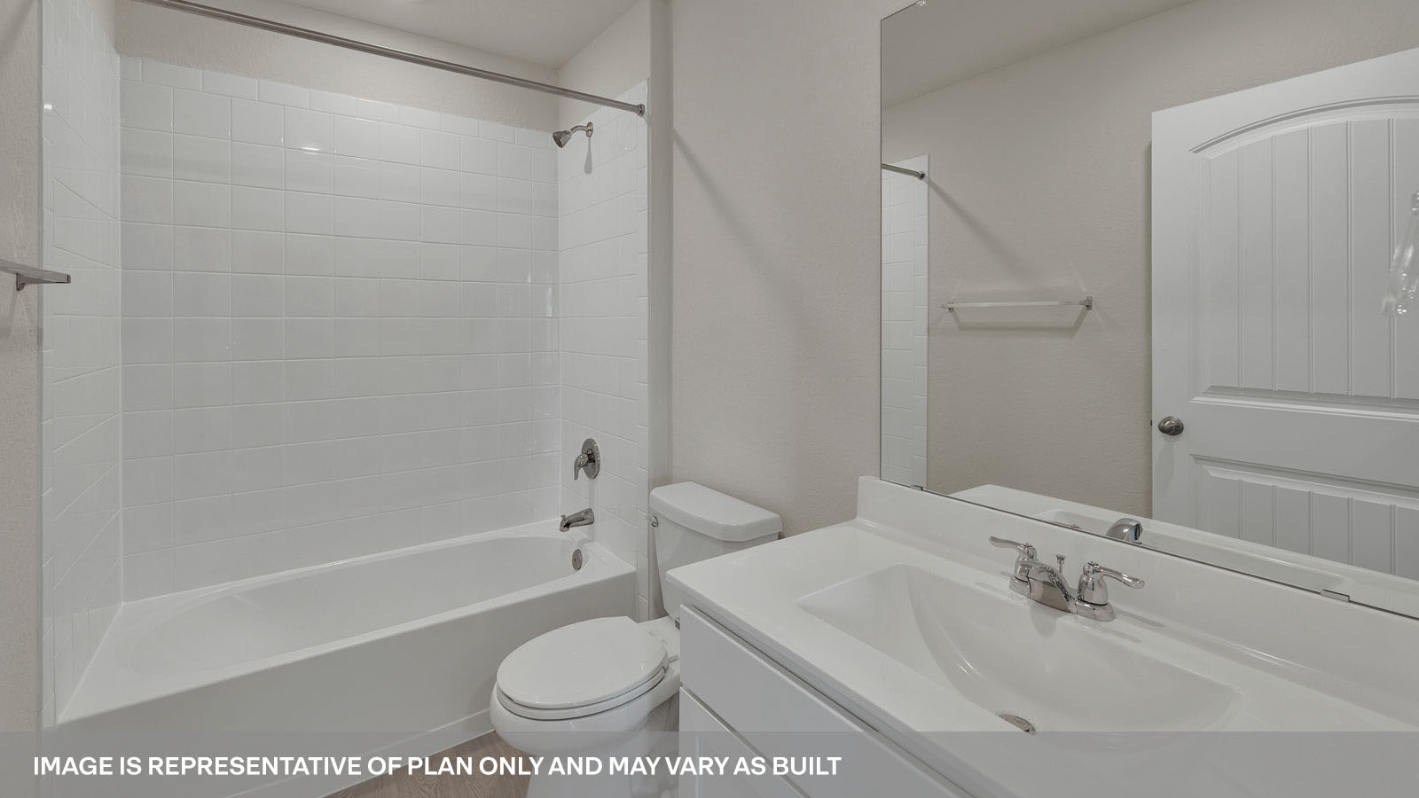 Bathroom with single sink vanity, toilet and tub.