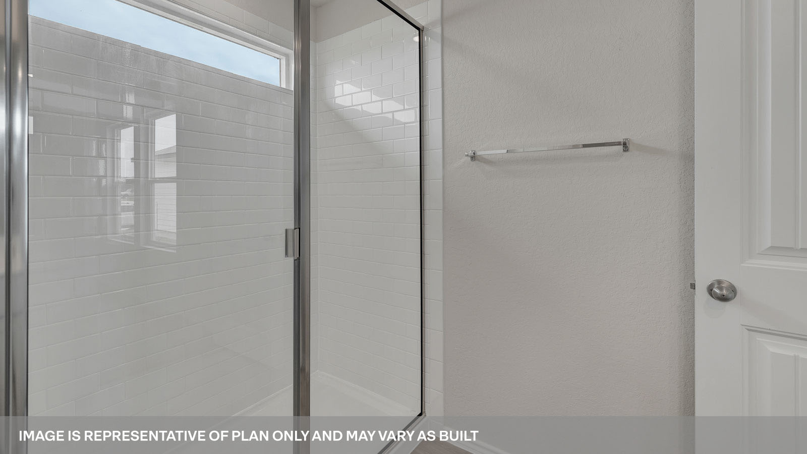 Main bathroom with walk-in shower and glass door.
