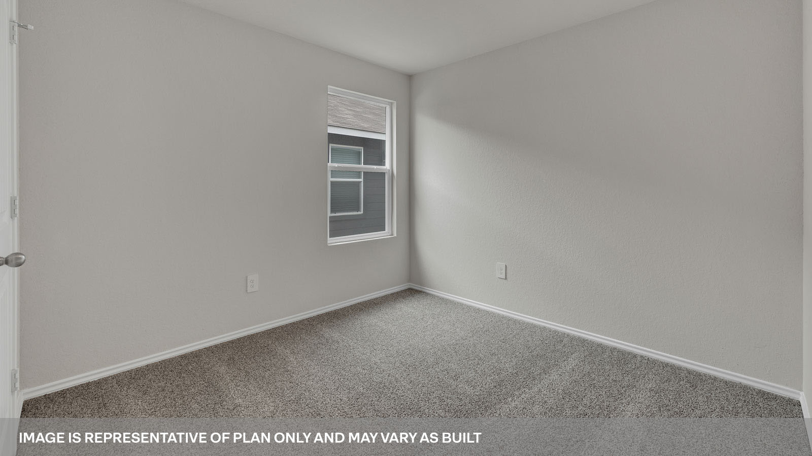 Bedroom with carpeting and one window.