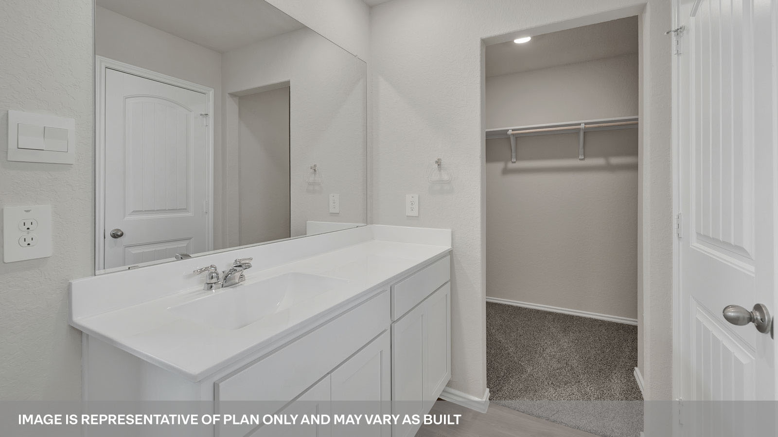Main bathroom with vanity and water closet.