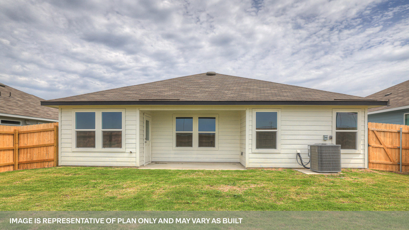 Covered patio with fully sodded backyard.