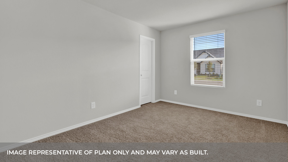 Front bedroom with carpeting and one window.