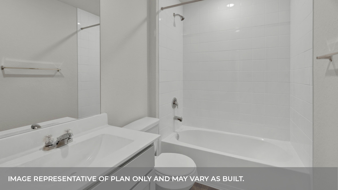 Hall bathroom with sink, toilet, and tub.