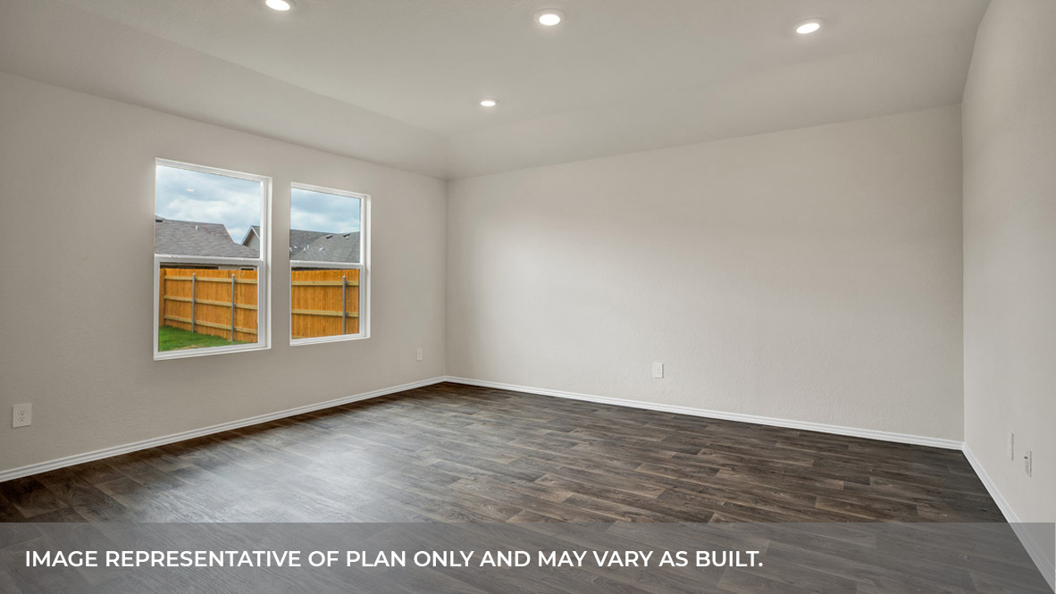 Living room with vinyl flooring and two windows.
