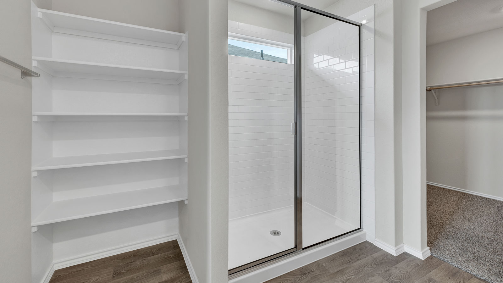 Main bathroom with walk-in shower and glass door.