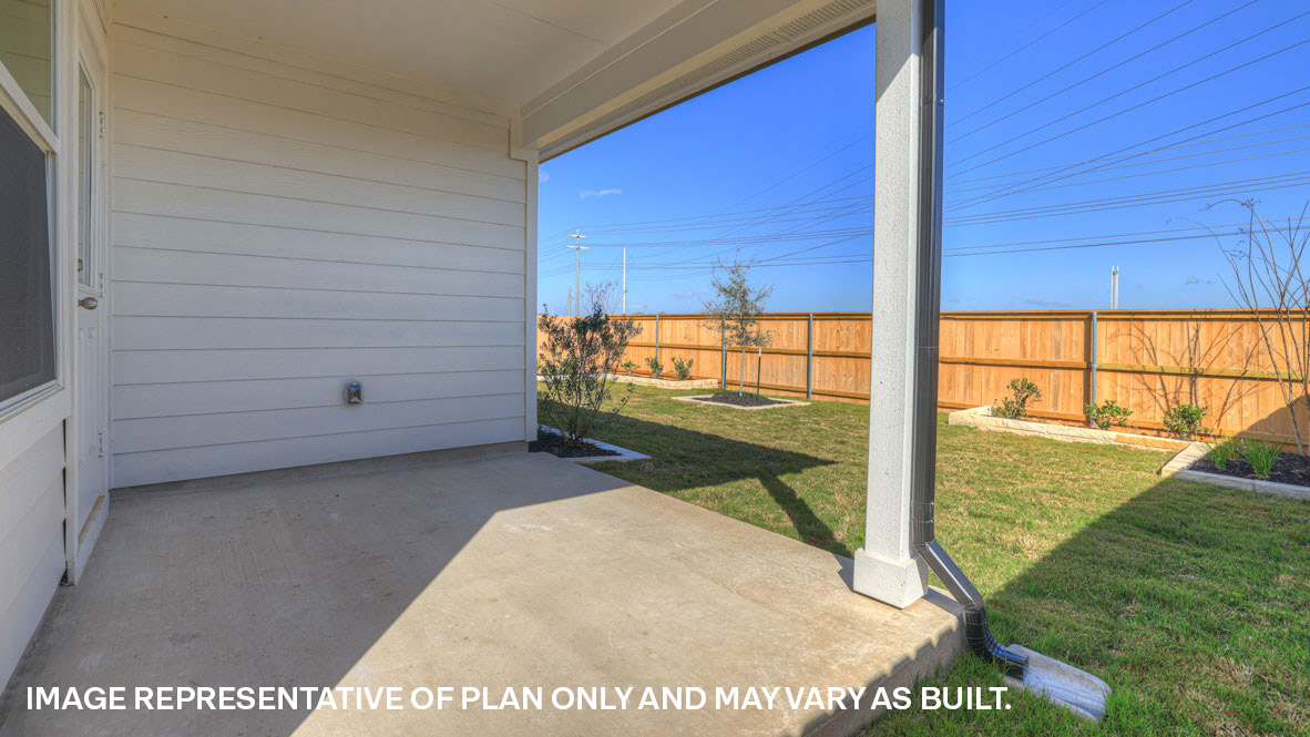 Covered patio with fully sodded backyard and privacy fence.