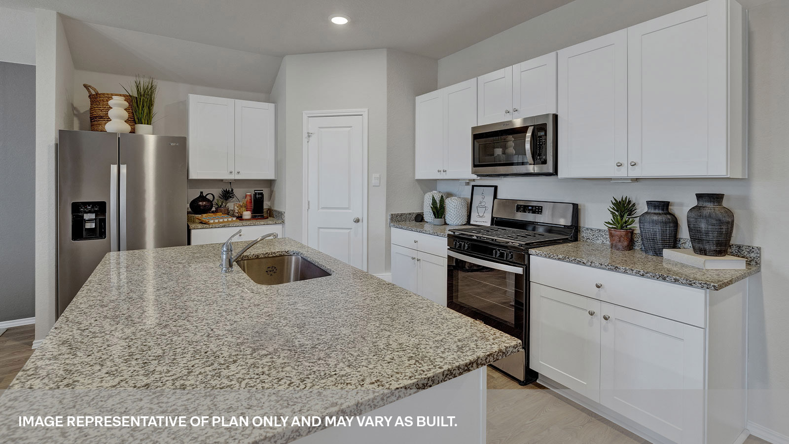 Kitchen with granite countertops and appliances.