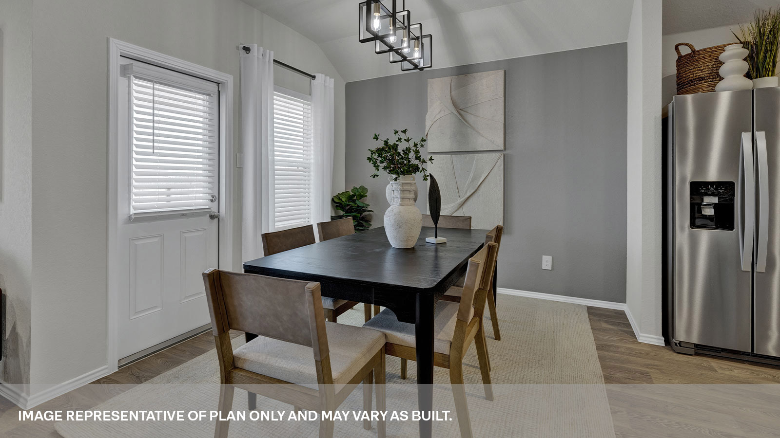 Dining room with vinyl flooring and two windows.