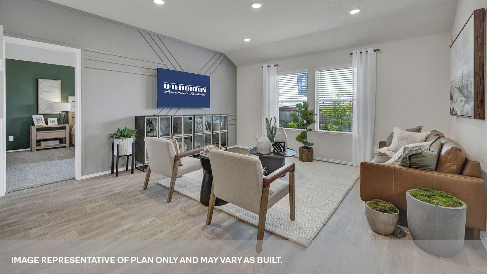 Living room with vinyl flooring and two windows.