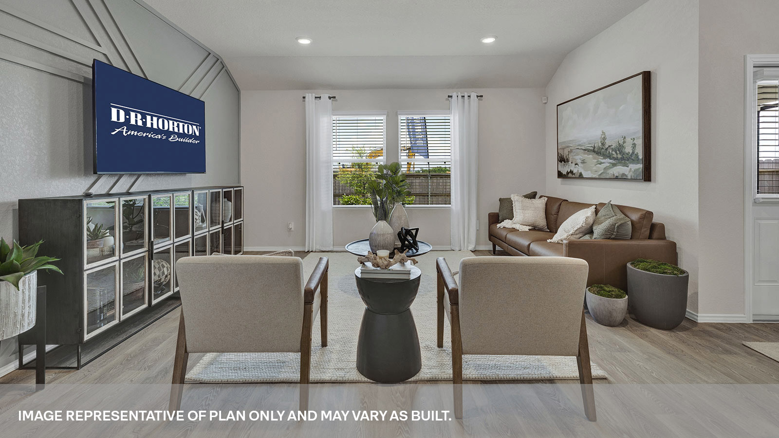 Living room with vinyl flooring and two windows.