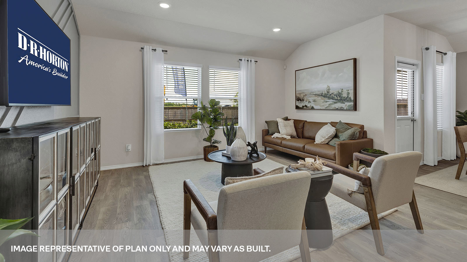 Living room with vinyl flooring and two windows.