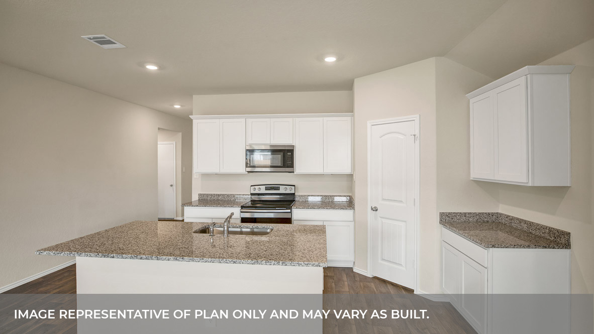 Kitchen with kitchen island and granite countertops.