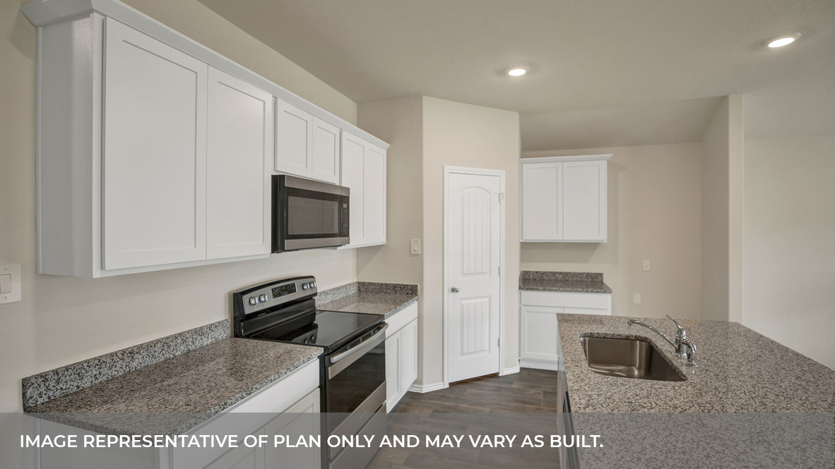 Kitchen island with granite countertops and kitchen sink.