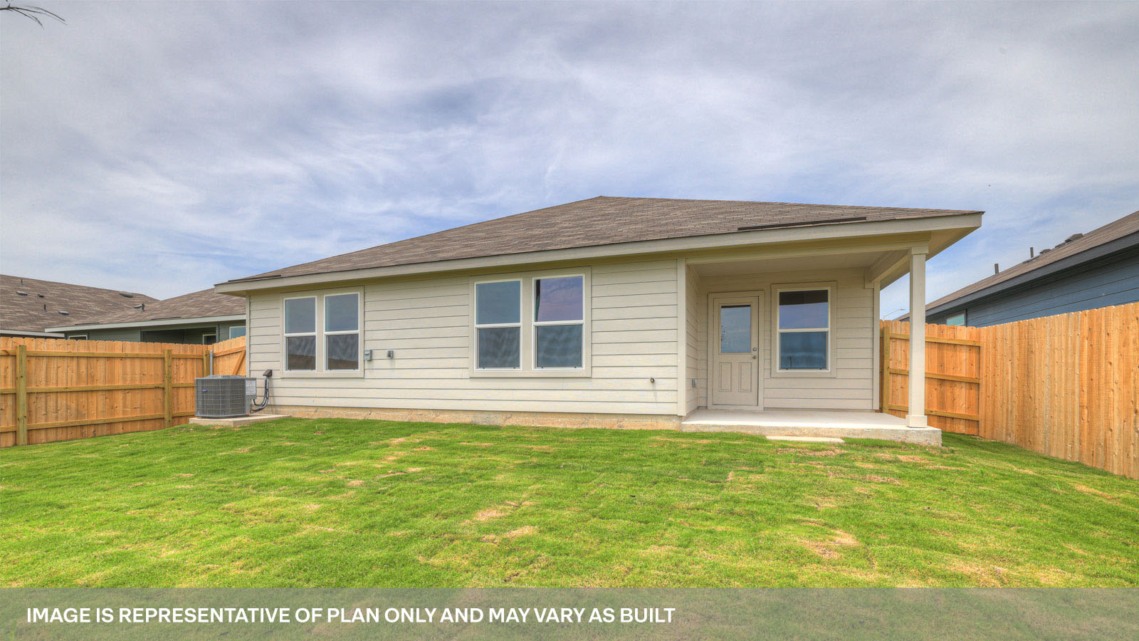 Covered patio with fully sodded backyard and privacy fence.