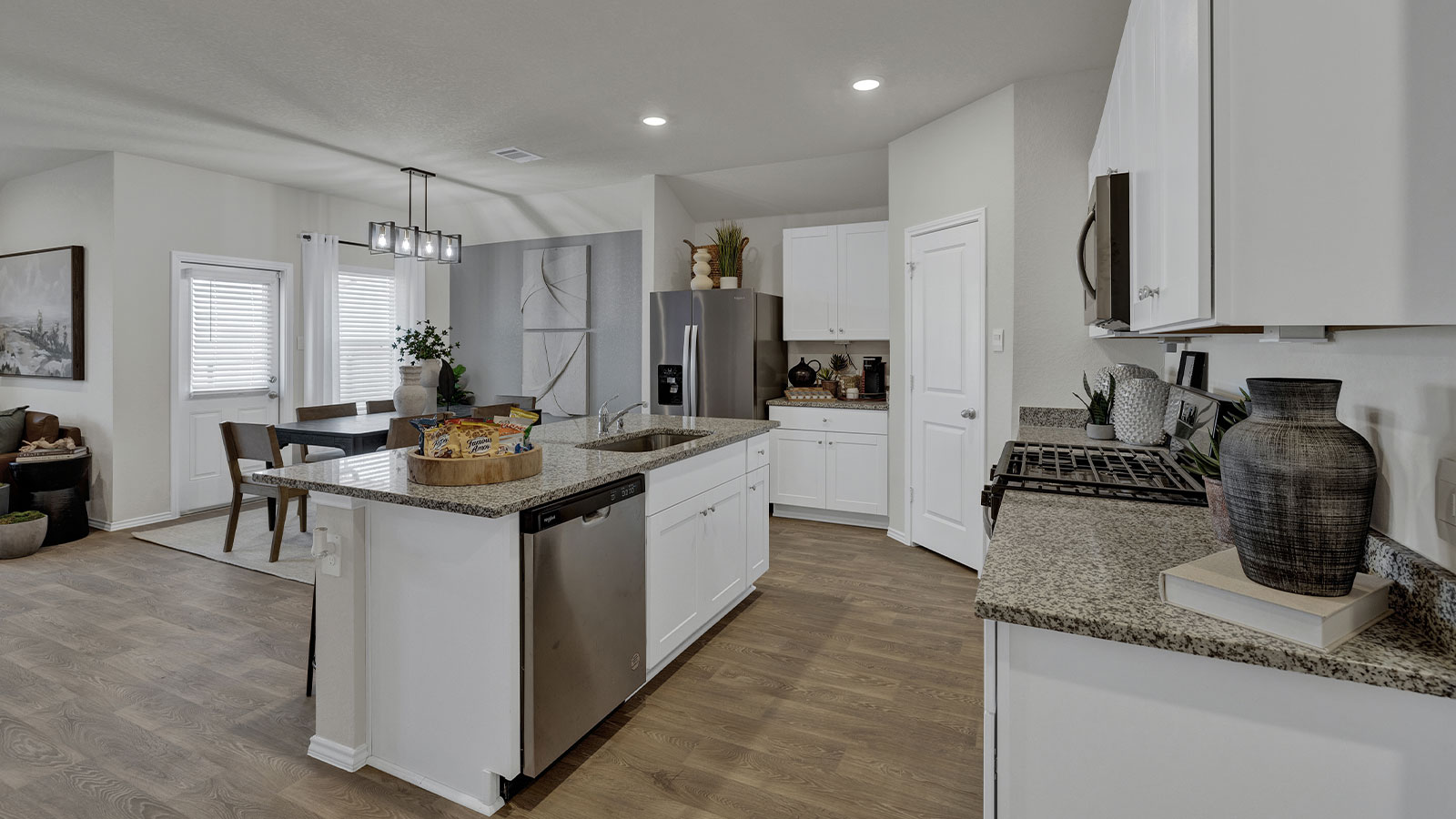 Kitchen with kitchen island and granite countertops.