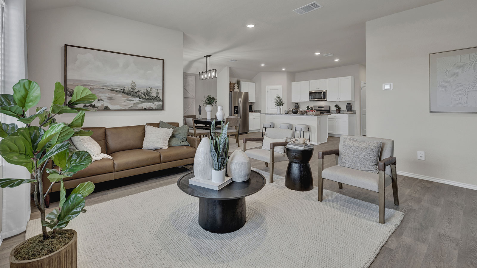 Living room with vinyl flooring and two windows.