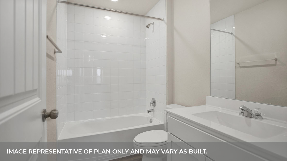 Hall bathroom with single sink vanity, toilet, and tub.